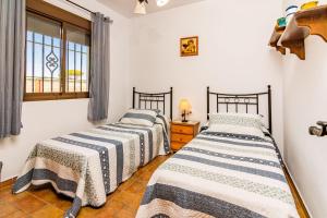 Postel nebo postele na pokoji v ubytování Familia Amaya Gonzalez