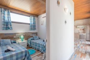 Postel nebo postele na pokoji v ubytování Casa Capricho