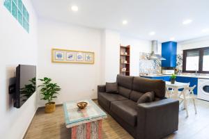 Televízia a/alebo spoločenská miestnosť v ubytovaní Apartamento Margarita - Remedios