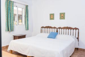 A bed or beds in a room at Cala Serena Beach 6