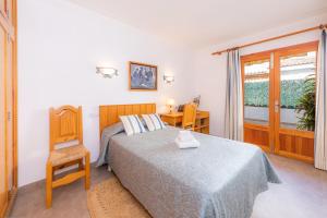 A bed or beds in a room at Margarita