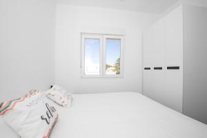 Łóżko lub łóżka w pokoju w obiekcie Apartamento Marei 3