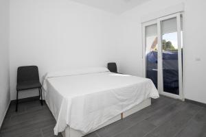 Łóżko lub łóżka w pokoju w obiekcie Apartamento Marei 1
