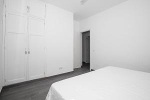 Łóżko lub łóżka w pokoju w obiekcie Apartamento Marei 1