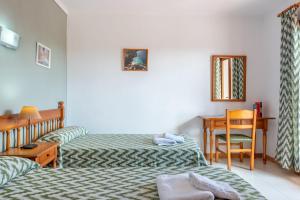 Tempat tidur dalam kamar di Apartamento Portosun Cornet