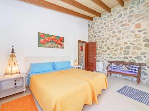 Een bed of bedden in een kamer bij Mamici