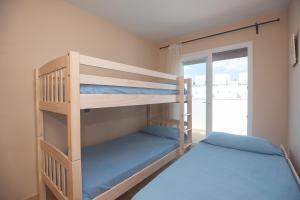 Łóżko lub łóżka w pokoju w obiekcie La Casa de la Dehesa- Sólo Familias