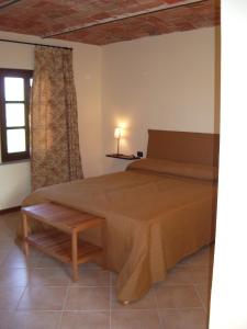 Tempat tidur dalam kamar di B&B Cascina Gaione Via Gallina,18b 12052 Neive cn