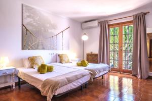 Postel nebo postele na pokoji v ubytování Casa Mamita Ibiza