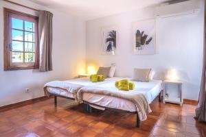 Postel nebo postele na pokoji v ubytování Casa Mamita Ibiza