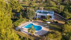 an aerial view of a villa with a swimming pool at Can Ramon 1 in Sant Josep de sa Talaia