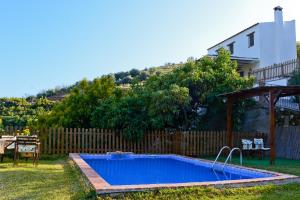 a swimming pool in the backyard of a house at Casa entre Nerja y Frigiliana in Frigiliana