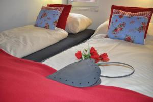 two beds with a bouquet of flowers on them at Haus Piesendorf in Piesendorf