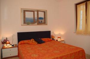 A bed or beds in a room at Appartamenti Le Querce - Lentisco