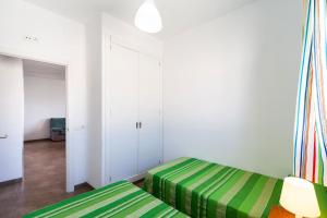 Posteľ alebo postele v izbe v ubytovaní Villa Los Olivares