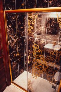 a glass door with a reflection of a bathroom at GRAND ŞELALE HOTEL in Cayeli