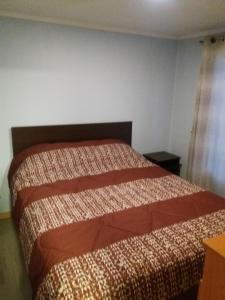 Postel nebo postele na pokoji v ubytování Cabañas Rivadavia Spa