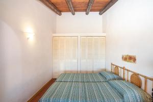 Postelja oz. postelje v sobi nastanitve Casa Baja Sardinia