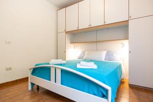 מיטה או מיטות בחדר ב-Casa Giovanna