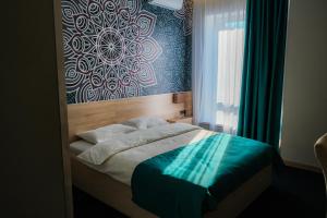 מיטה או מיטות בחדר ב-Altyn Shatyr Hotel and Restaurant