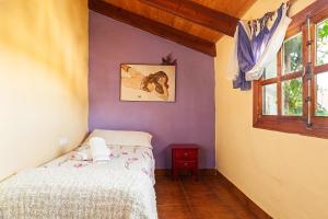 Łóżko lub łóżka w pokoju w obiekcie Casa Balcón - Sólo Familias