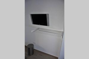 Televízia a/alebo spoločenská miestnosť v ubytovaní Apartamento Moderno y acogedor Antú, cerca de la playa