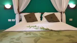 Tempat tidur dalam kamar di Tacacori EcoLodge