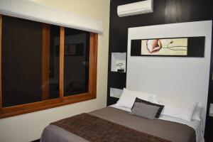 Postel nebo postele na pokoji v ubytování Hotel La Laguna Galapagos
