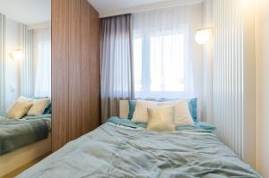 Posteľ alebo postele v izbe v ubytovaní Apartament Różana