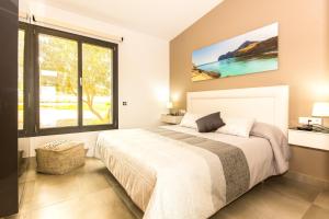 Ein Bett oder Betten in einem Zimmer der Unterkunft Villa Ca Na Marga