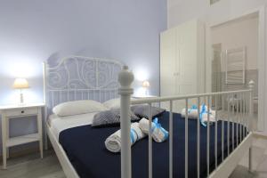 Posteľ alebo postele v izbe v ubytovaní B&B Vitruvio Suites