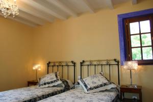 Ένα ή περισσότερα κρεβάτια σε δωμάτιο στο Posada El Hidalgo