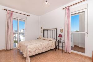Postel nebo postele na pokoji v ubytování Apartamento las Torres + 27 fotografií