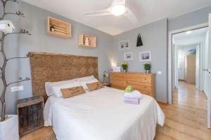 Łóżko lub łóżka w pokoju w obiekcie Apartamento "soñac sol"