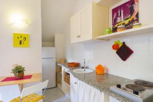 a kitchen with a sink and a counter top at Monolocale casa Lucia in Campo nell'Elba