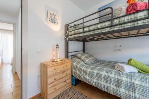 Łóżko lub łóżka w pokoju w obiekcie Apartamento "soñac sol"