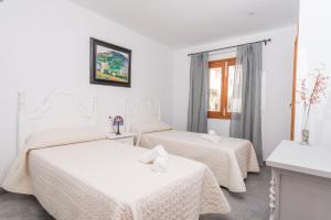 Ein Bett oder Betten in einem Zimmer der Unterkunft S Olivera