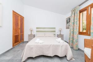 Ein Bett oder Betten in einem Zimmer der Unterkunft S Olivera