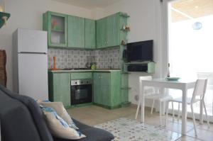 Virtuvė arba virtuvėlė apgyvendinimo įstaigoje Perla sul mare Adriatico