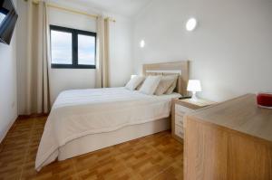 Кровать или кровати в номере Apartamento Ye