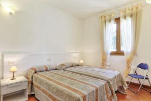 Giường trong phòng chung tại Villa Vanna Trilo -quadrilocale