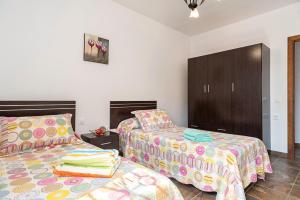 Postel nebo postele na pokoji v ubytování Chalet Rocío - solo familias