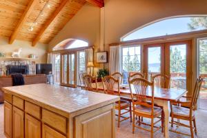 a kitchen and dining room with a table and chairs at Altdorf Vista in Tyrolian Village