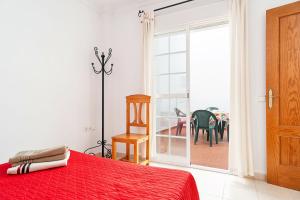 Łóżko lub łóżka w pokoju w obiekcie Apartamento Doña Alba