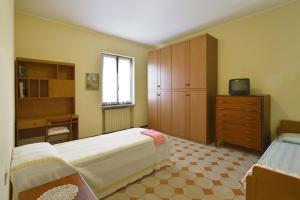 Posteľ alebo postele v izbe v ubytovaní Casa Nonna Rina