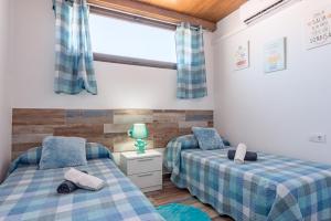 Postel nebo postele na pokoji v ubytování Casa Capricho