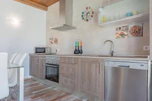 Kuchyň nebo kuchyňský kout v ubytování Casa Capricho