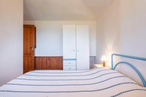 Accu is prezzus I 30mt dal mare客房内的一张或多张床位