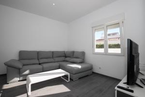 Telewizja i/lub zestaw kina domowego w obiekcie Apartamento Marei 1