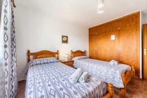 Postel nebo postele na pokoji v ubytování Villa Damian 12